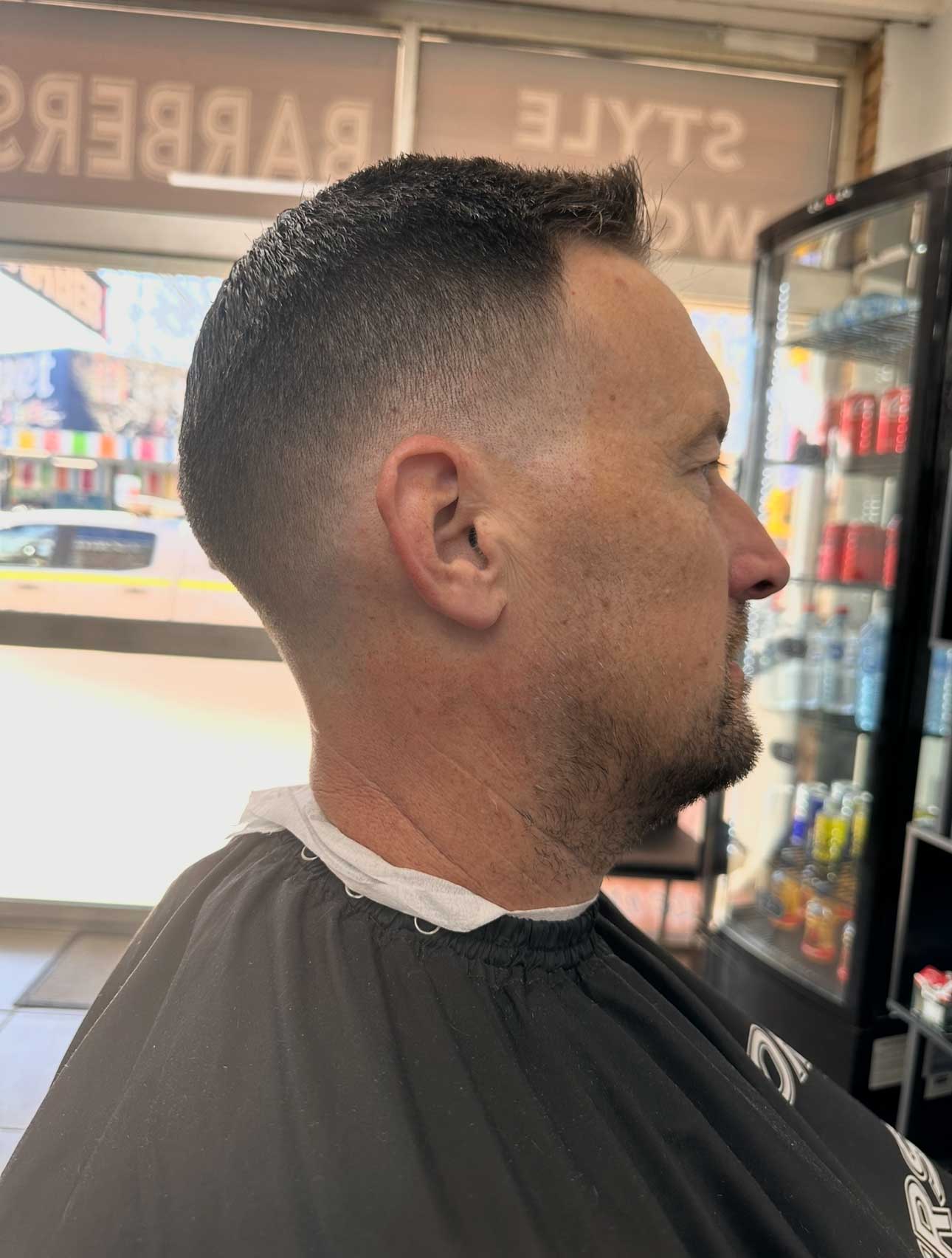 Men's skin fade haircut at Style World Barbers Engadine — precision side profile fade