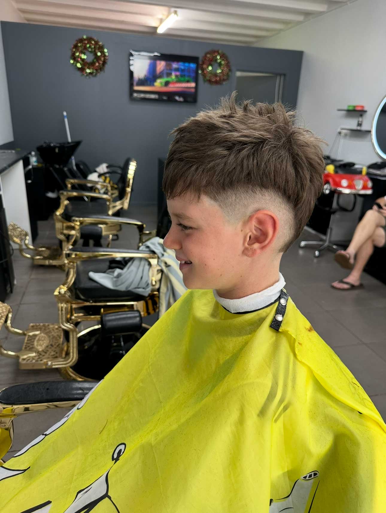 Junior textured haircut with skin fade at Style World Barbers Engadine